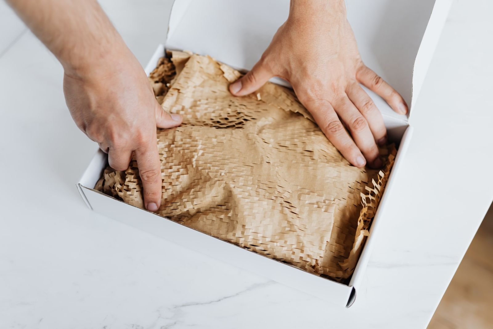 A handmade order being carefully wrapped for delivery