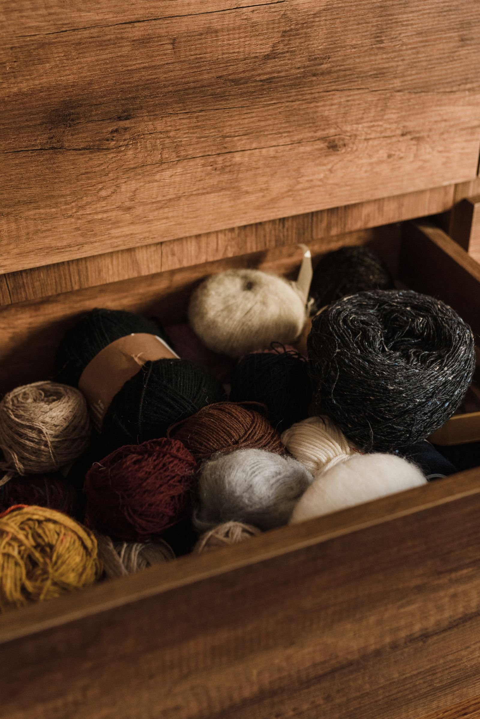 A creative studio drawer filled with colourful yarn